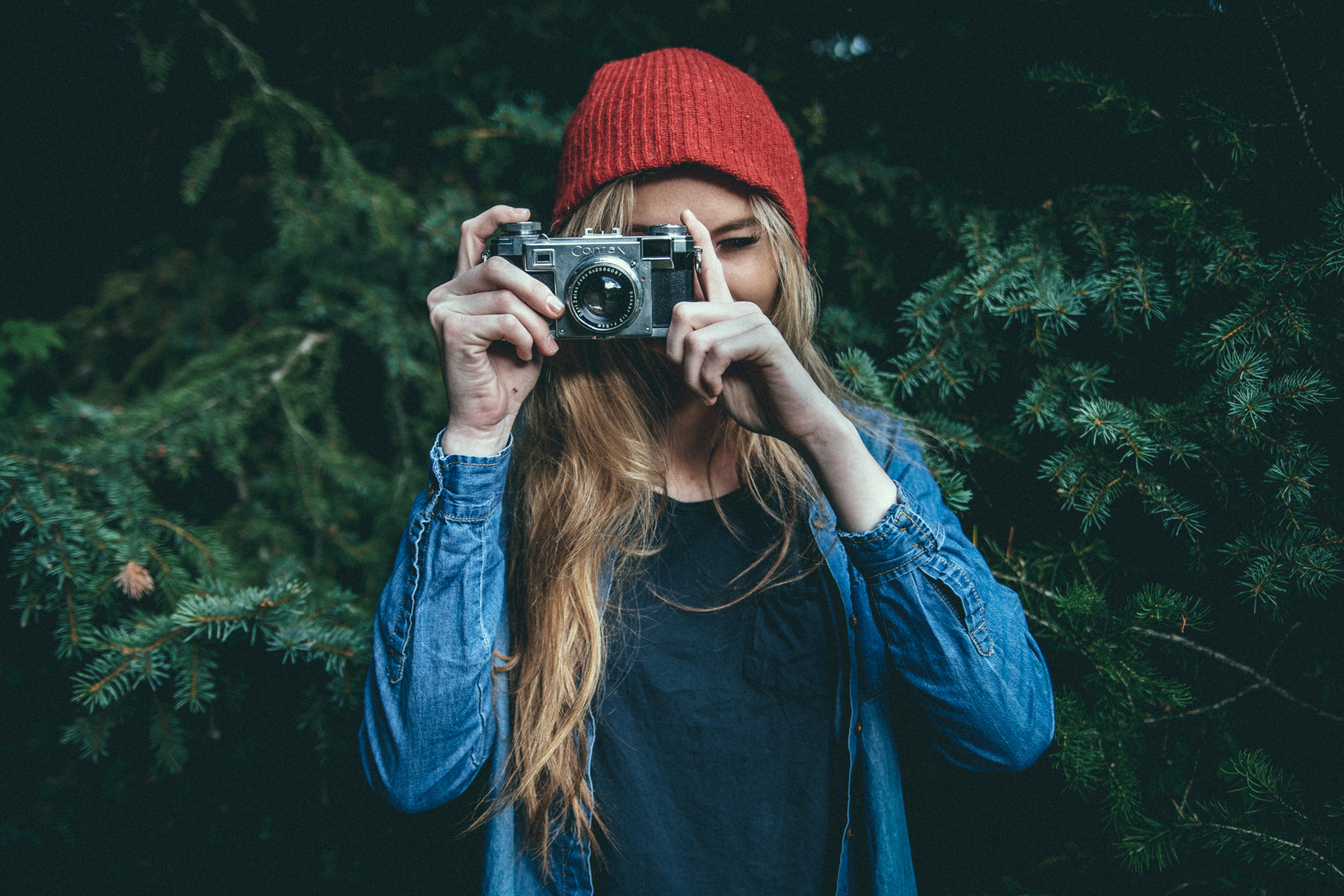 Woman taking picture with camera